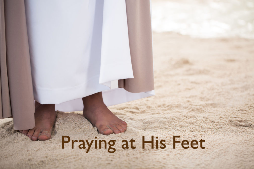 Feet of Jesus on sand